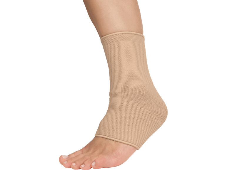Ankle with a beige support brace on a black background