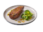 Grilled steak with fresh arugula and mango salad on a plate.