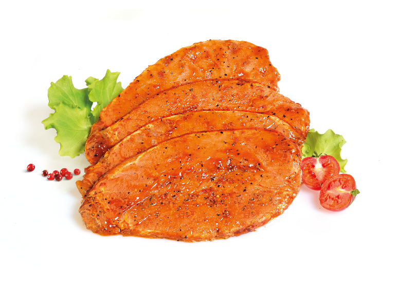 Marinated pork cutlets with lettuce, cherry tomatoes, and pink peppercorns.