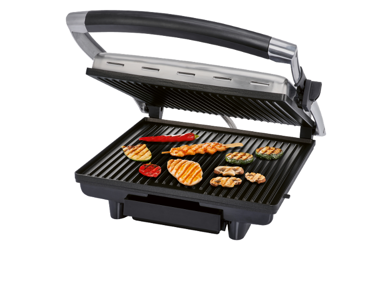 Electric grill with an open lid, grilling chicken, vegetables, and mushrooms.