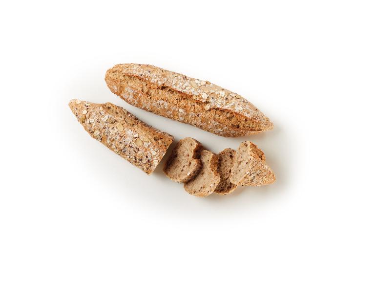Sliced cereal breads on a white background.
