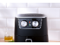 Black air fryer with silver temperature and time control knobs