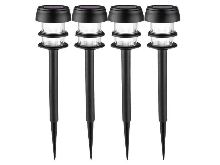 Four black solar-powered garden path lights with white illumination.
