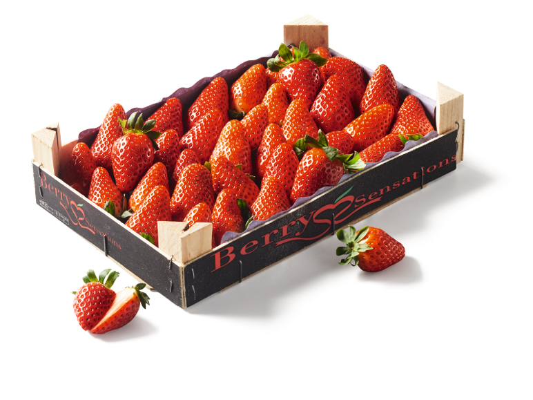 Crate of fresh strawberries with 'Berry Sensations' text.