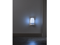 Night light casting blue light onto a wall and floor.