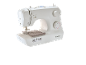 White sewing machine with fabric under the needle, ready for sewing.