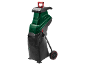 Green electric shredder with a red handle and a black collection bag.