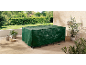 Green protective cover for garden furniture on a wooden patio.