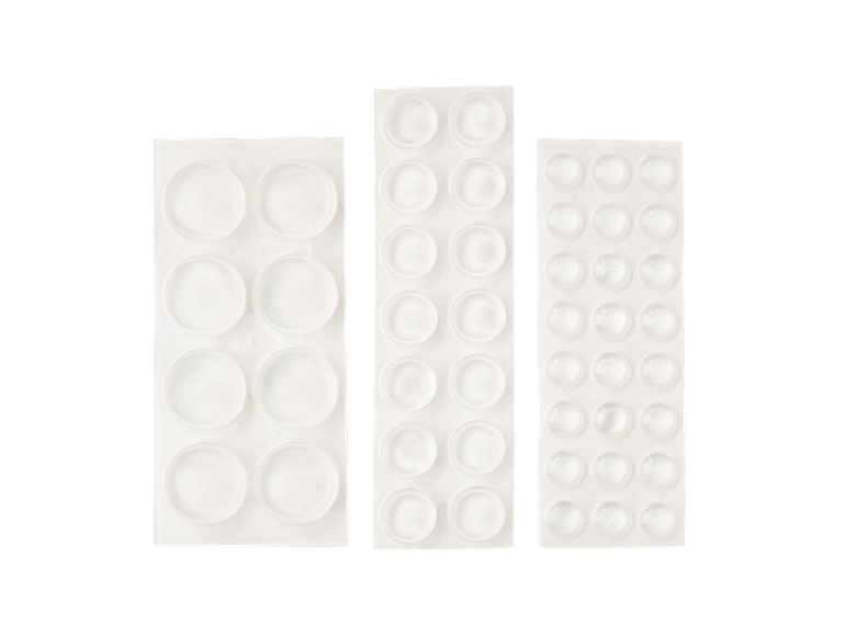 Clear rubber bumpers in various sizes for surface protection.