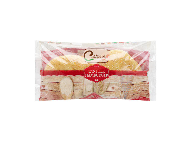 Packaged hamburger buns with sesame seeds, featuring a wooden background and kitchen utensils.