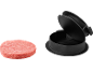 Raw burger patty and black burger press.