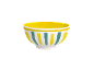 White bowl with yellow interior and yellow and teal vertical stripes