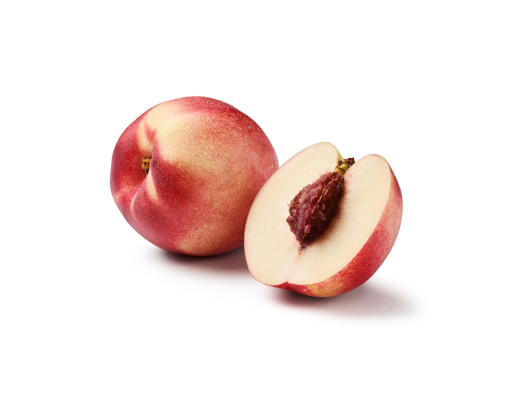 Fresh nectarine and a halved nectarine with its pit visible.