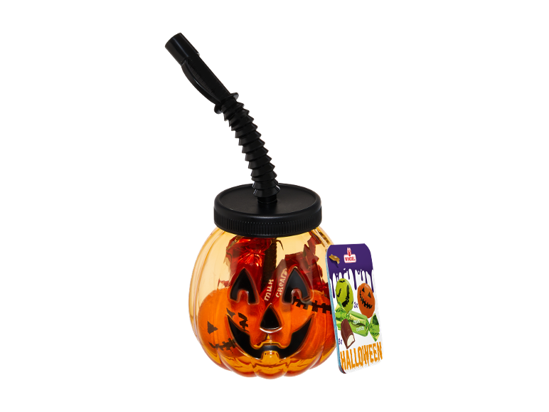 Halloween pumpkin-shaped jar with a straw, filled with candies, and a Halloween-themed candy pack.