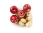 Red apples, whole and cut, on a white background.