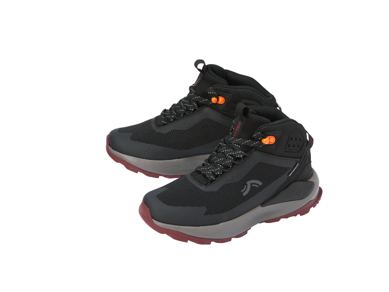 Black waterproof hiking boots with orange details and a red sole.