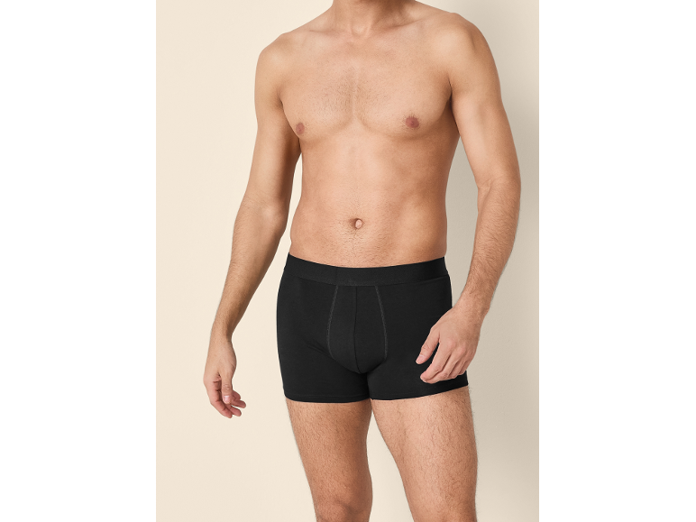 Shirtless man wearing black boxer briefs.
