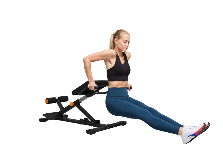 Woman performing dips on an exercise bench.