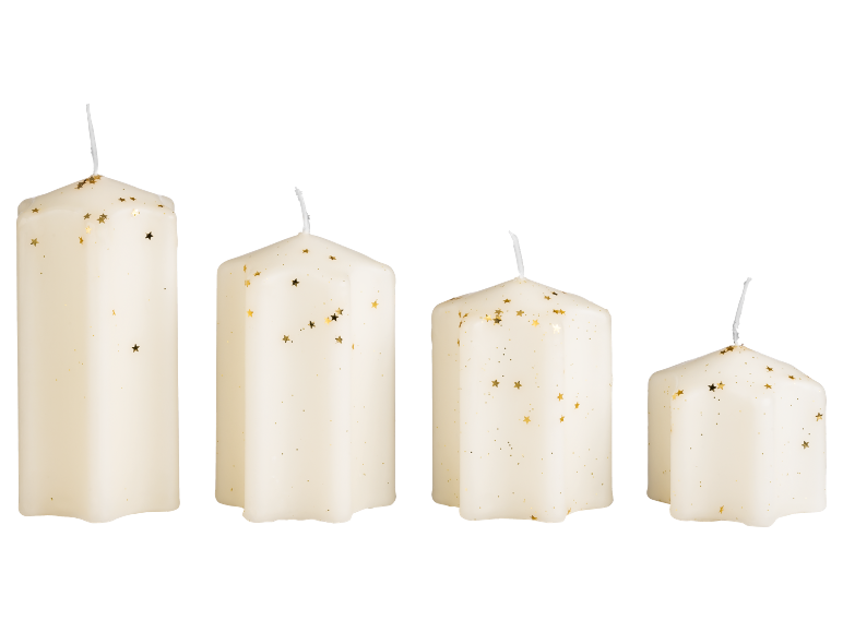 Four white candles of varying sizes with gold star-shaped glitter.