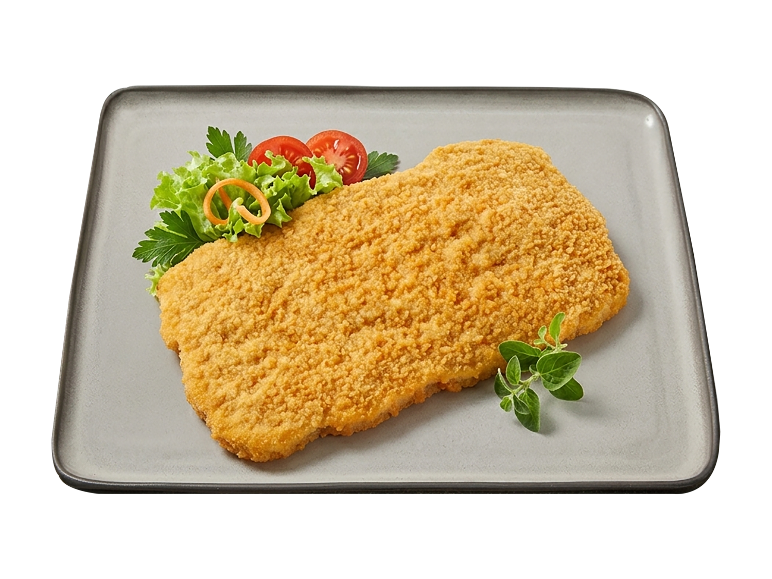 Breaded schnitzel with tomato, lettuce, and parsley garnish.