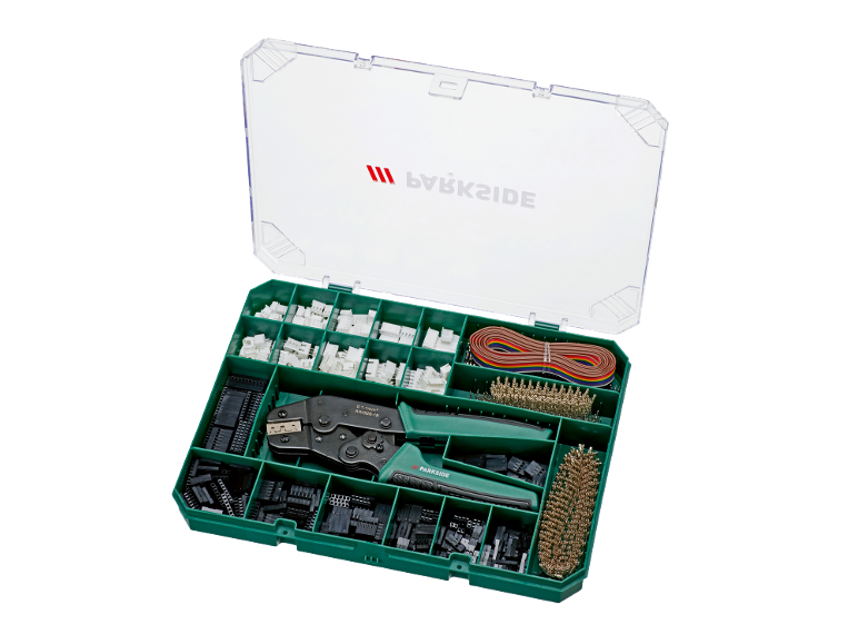 Crimping kit with pliers, connectors, and wires in a green box.