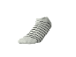 White ankle sock with black horizontal stripes.