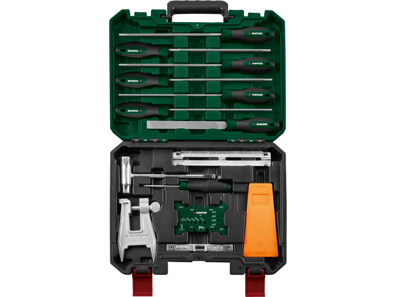 Chainsaw chain sharpening kit with various tools, including files and a depth gauge.