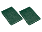 Two folded green tarpaulins with a textured surface