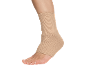 Ankle with a beige support brace on a black background