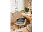 Ergonomic seat cushion on an office chair in a home office setting.