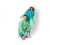 Two people wearing rain ponchos and matching socks, smiling.