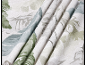 Curtain with a leaf pattern in green and blue hues.