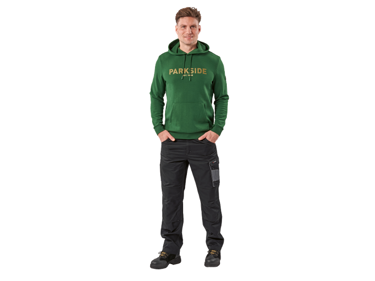 Man in green hoodie with 'PARKSIDE EST. 1996' text and black work trousers.
