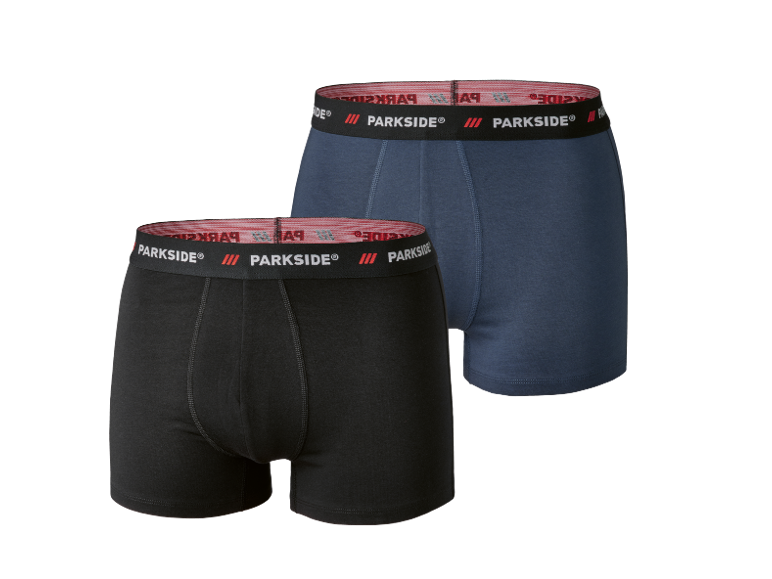 Two men's cotton boxer shorts, one black and one blue, with a logo elastic waistband.