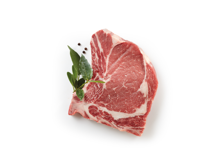 Raw cut of meat with herbs and peppercorns on a white background.