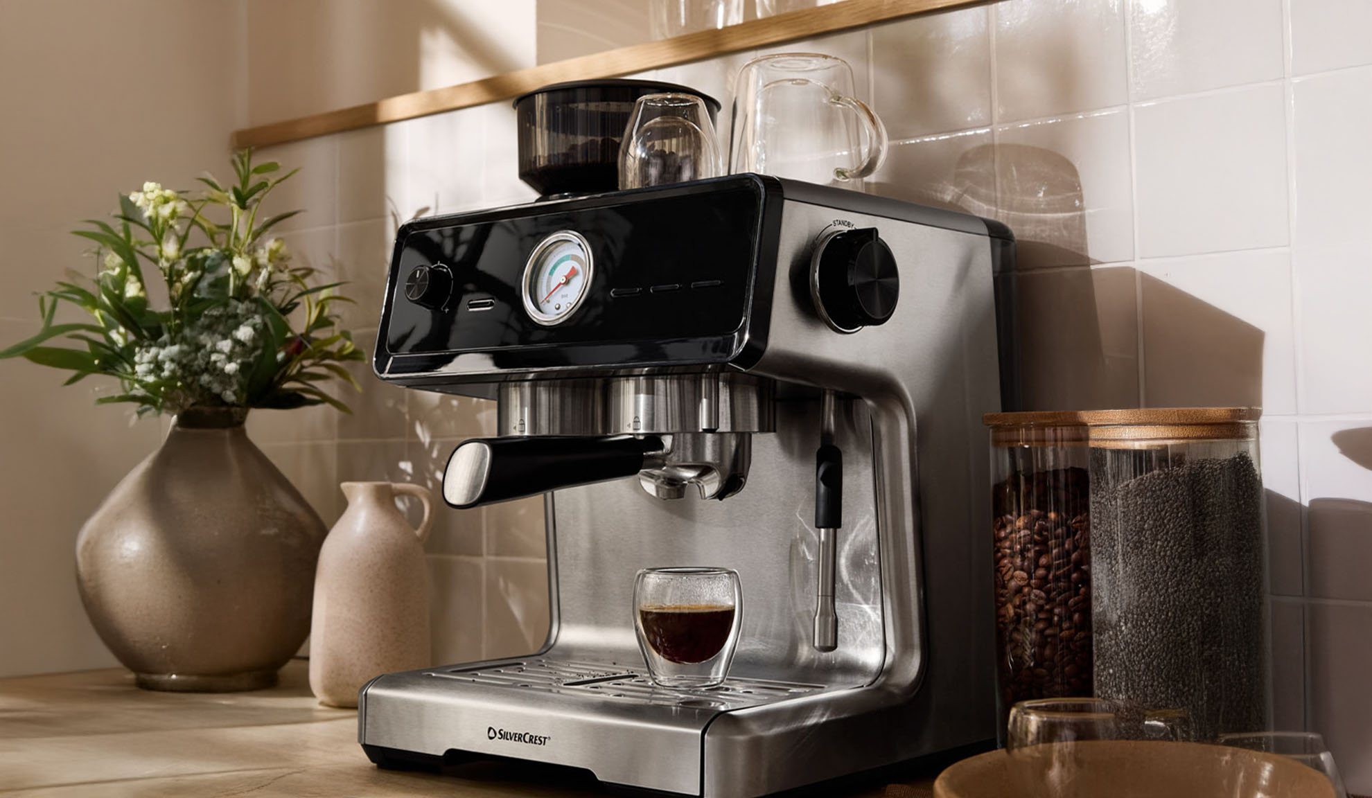SilverCrest espresso machine on a kitchen counter with coffee beans and chia seeds.