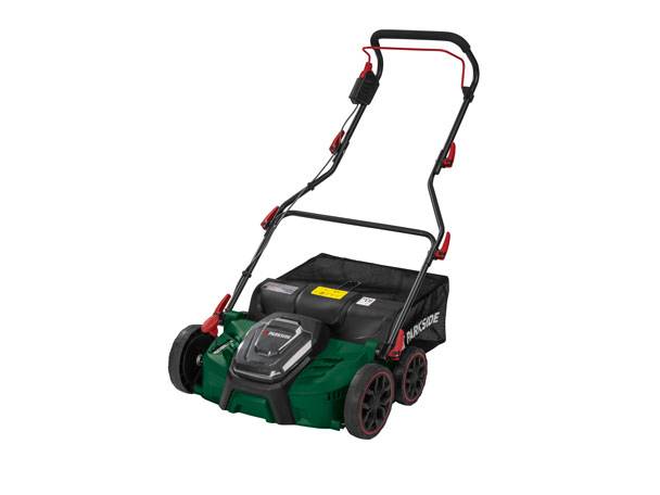 Green cordless lawnmower with a black grass collection bag and red accents.