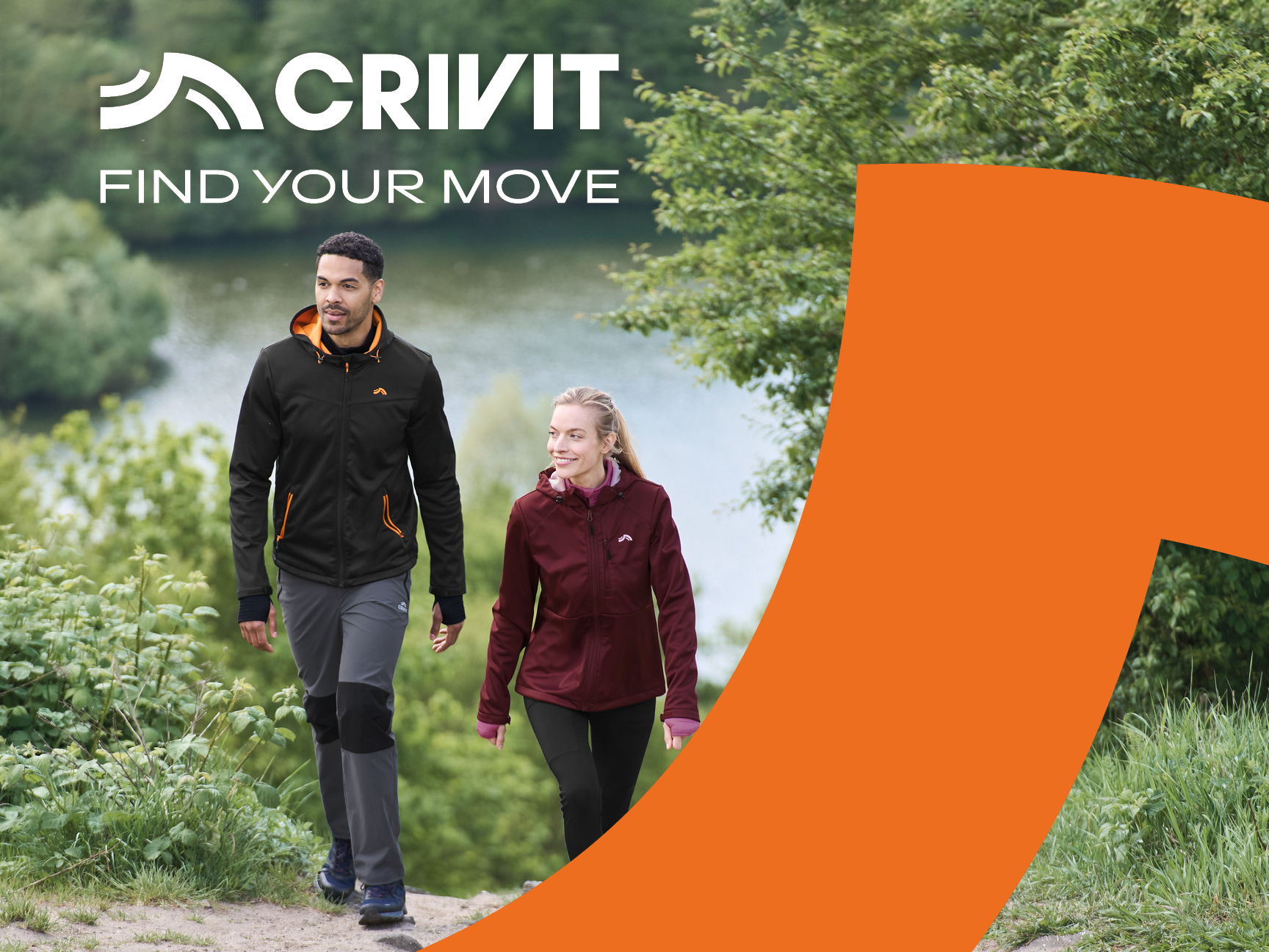 Two people in Crivit activewear walk outdoors, with a lake in the background.