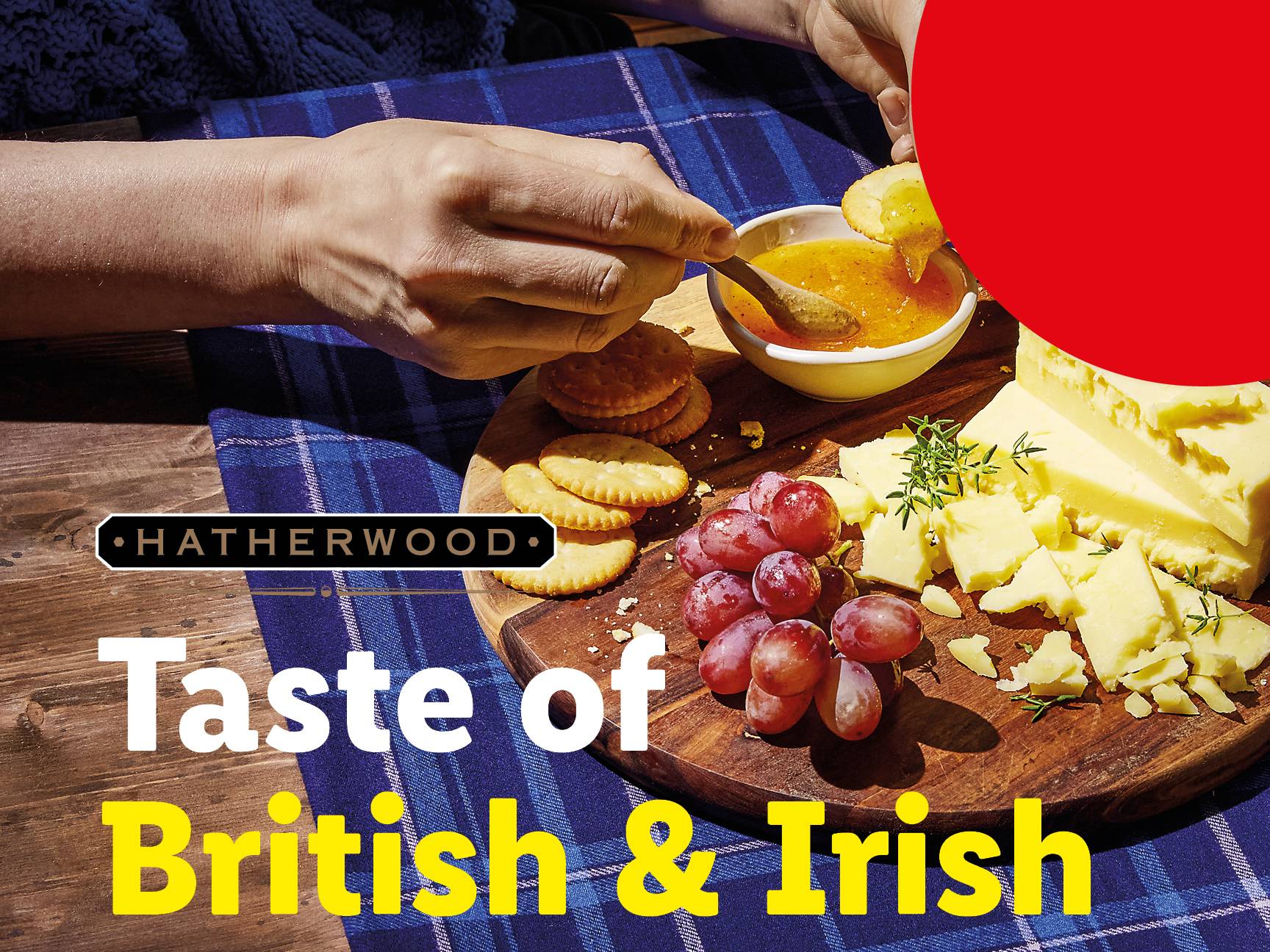 Hatherwood cheese board with crackers, grapes, and jam, promoting British & Irish food.