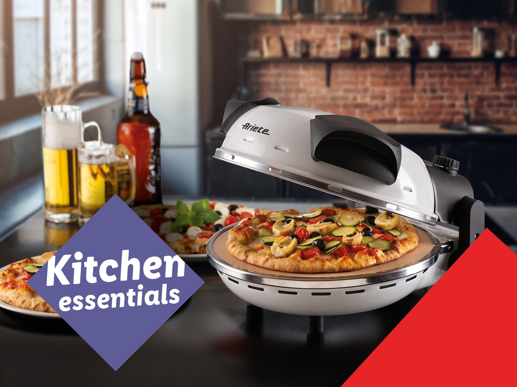 Ariete pizza oven with a cooked pizza, beer, and other kitchen items.