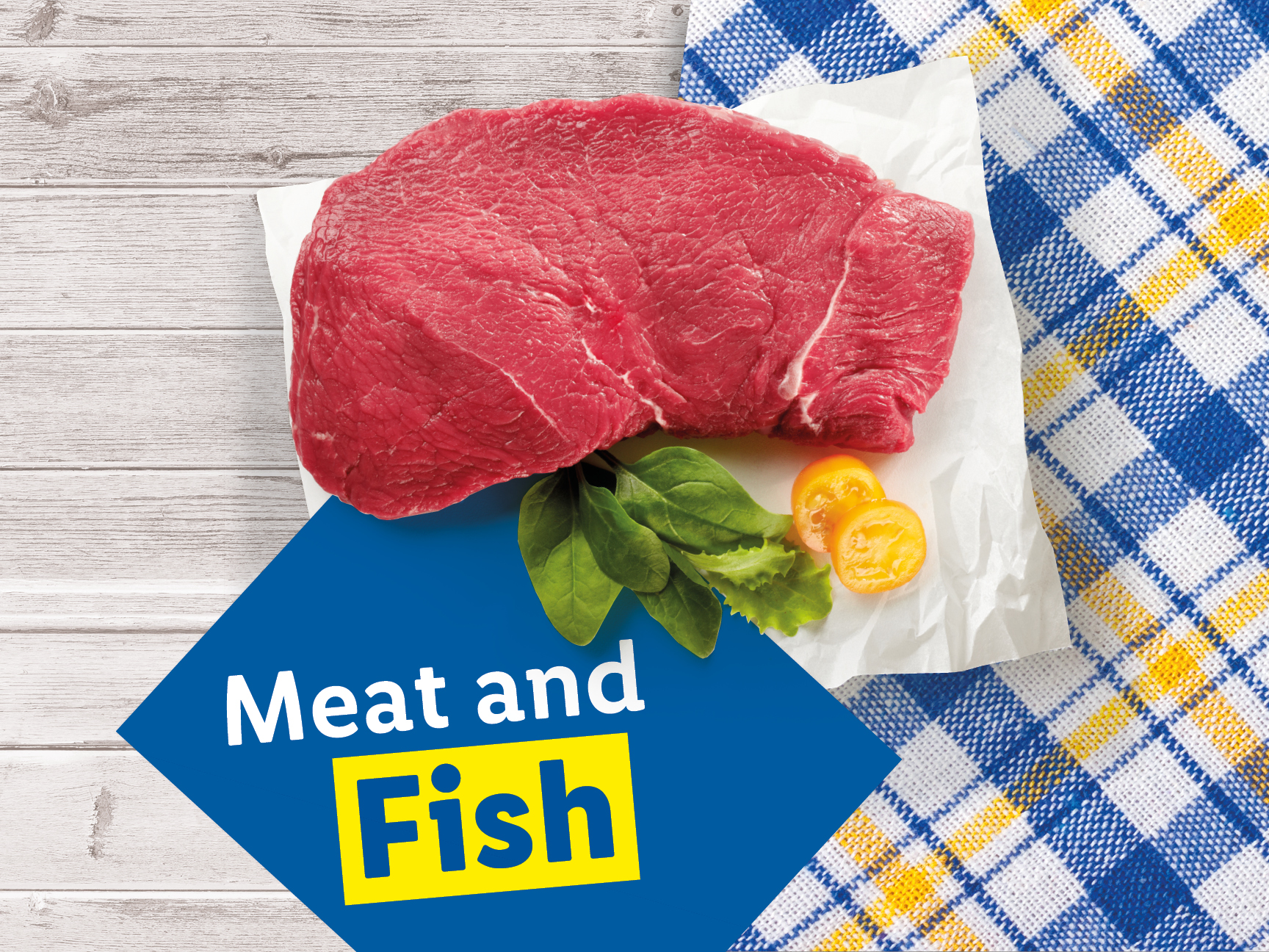 A raw beef steak on white paper with spinach and tomatoes, next to a blue and yellow plaid cloth, with a blue diamond overlay that says 'Meat and Fish'.