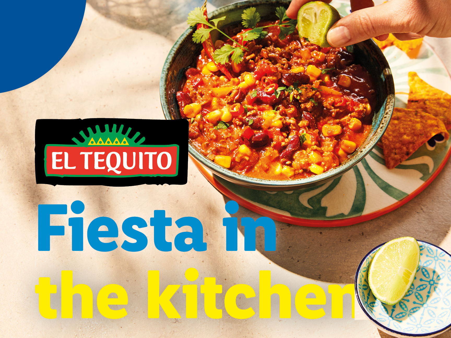 El Tequito chili con carne with lime, cilantro, and tortilla chips.