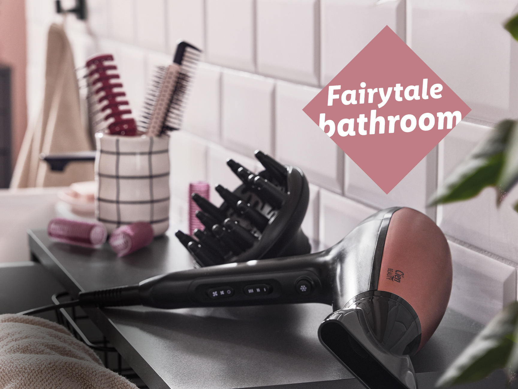 A hairdryer with a diffuser and hairbrushes on a bathroom counter, with text 'Fairytale bathroom'.