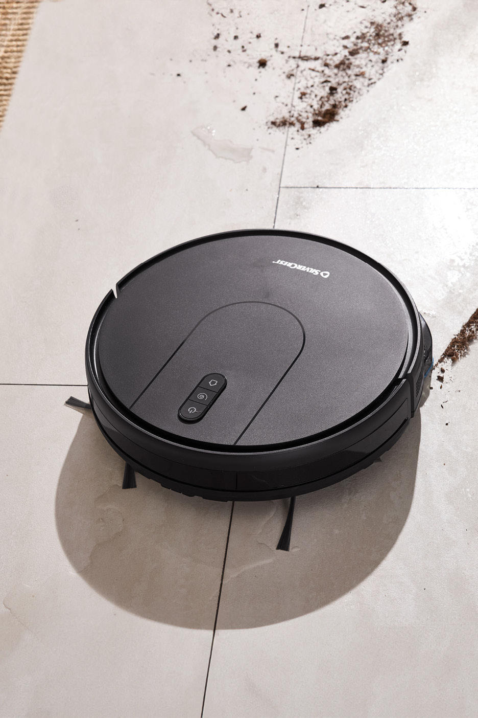 Silvercrest robotic vacuum cleaner on a dirty tiled floor