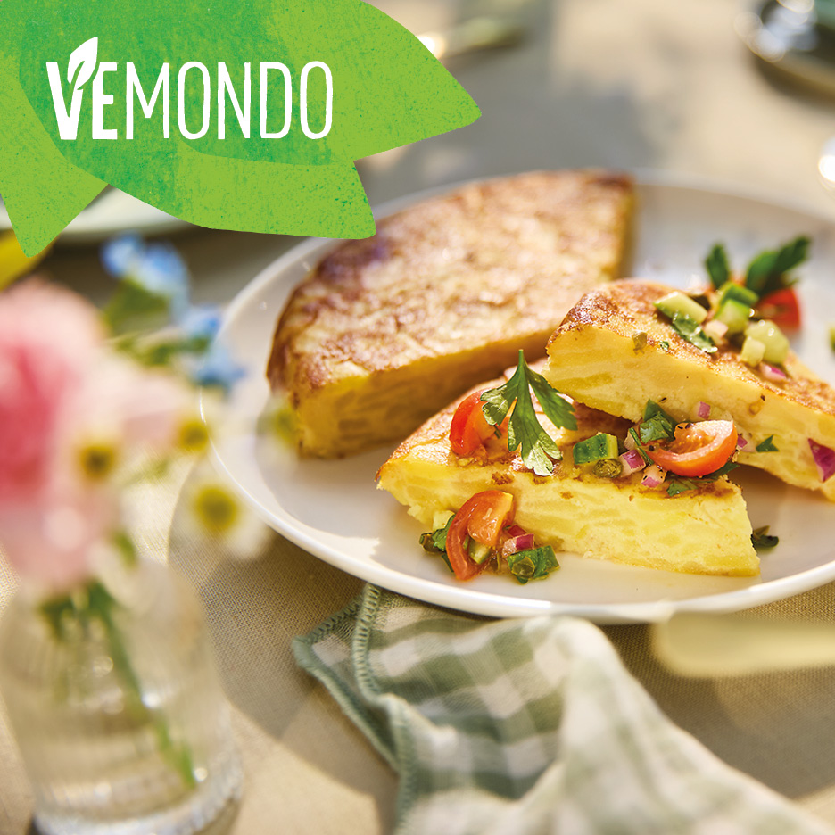 Vemondo Spanish omelette slices with fresh salsa on a white plate.