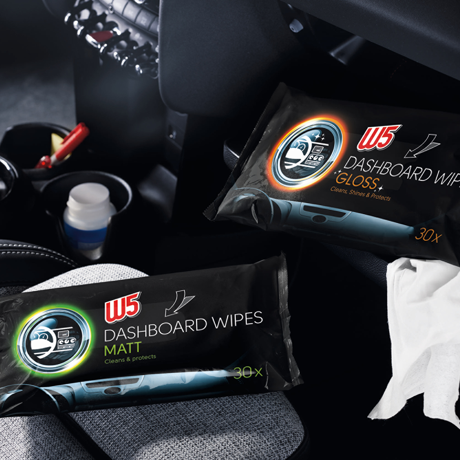 Two packs of dashboard wipes, one for matt and one for gloss finish, in a car interior.