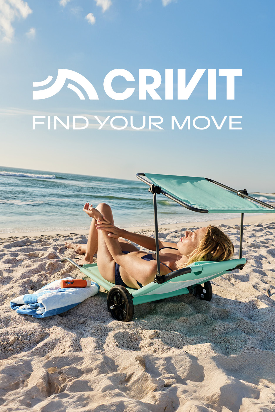 Woman relaxing on a beach lounger with wheels and sunshade, applying sunscreen.