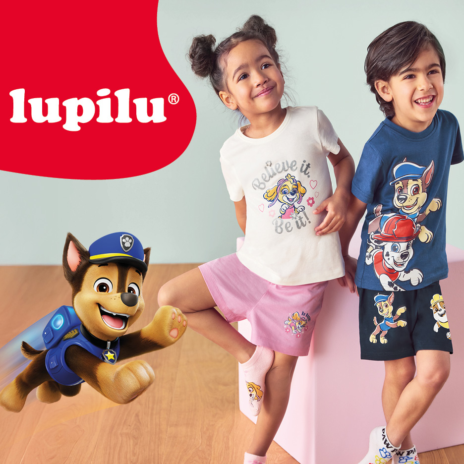 Two children in Paw Patrol themed t-shirts and shorts, with a digital Chase character.
