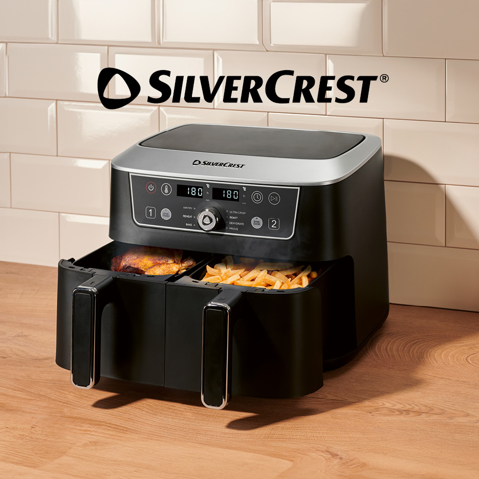 Dual-basket air fryer with chicken and fries, displaying 180 degrees and various cooking modes.