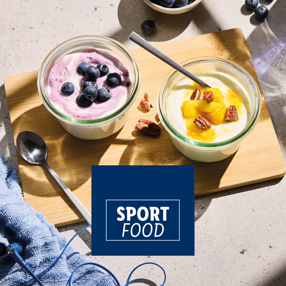 Yogurt with blueberries and yogurt with mango and pecans, with 'SPORT FOOD' text.